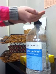 Student using handsantizer to prevent the spread of the flu