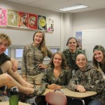 Latin teacher Marci Krebs, 10th period class poses for a shot after a successful day of camouflage.  