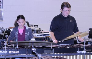 Percussionists play the xylophone during their part in the band's piece. 