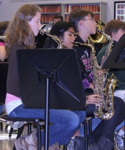 The saxophone players execute their notes to complete the song. 