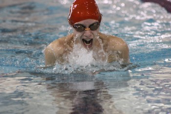 Sophomore Gibby Porter swims against Chambersburg boys in the breast stroke race. Photo By: Grace Burns