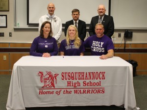 Druck signs her letter of intent to play at Holy Cross