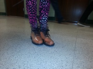 Photo by: Elise Delozier A student wears very flashy leggings and clear rubber madden girl boots on a snowy day. 