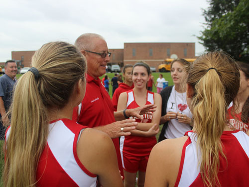 Coach Stough talks to the girls before the race to get them pumped up.
Photos By: Tyler Ritz 