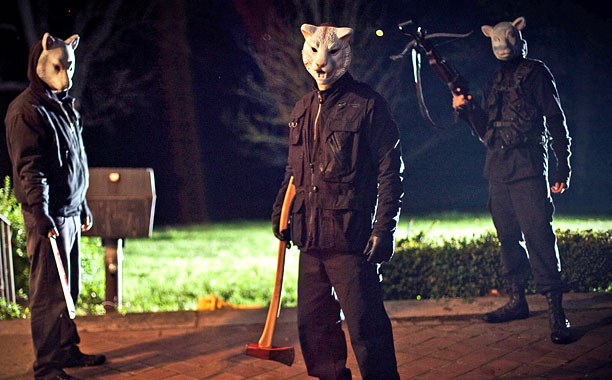 The masked killers in Youre Next stalk their victims. Still courtesy Lionsgate.