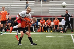 Sophomore Colton Mumley takes on the York Suburban defender to reclaim the ball. Photo By Laurie Kettinger  