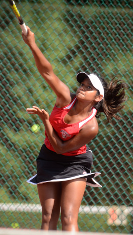 Usha Baublitz serves the ball to her opponent in a match. Courtesy of Lifetouch.