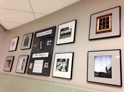 Pergrin put together a display of his work, which hangs by the library.  Photo By: Grace Burns