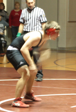 Senior Tucker Devilbiss stares down his opponent before engaging in a physical match. Photo by Mike the reporter