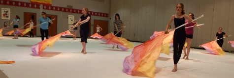 Color Guard practices for their first competition on the following day. Photo by: Logan Garvey