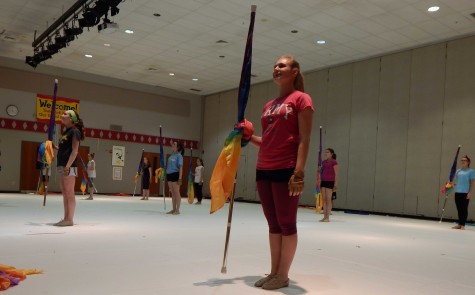 Students wait for the next part of the song in order to move to the next formation. Photo by: Logan Garvey