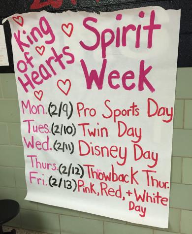 Student council-made posters inform students of what to wear during King of Hearts week. Photo by Karly Matthews.