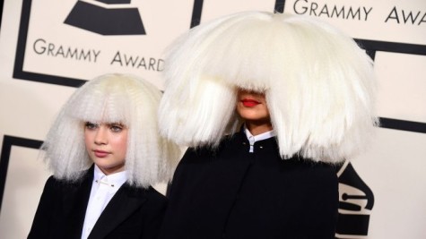 Sia arrives to the Grammys with dancer Maddie Ziegler. Photo courtesy Getty.