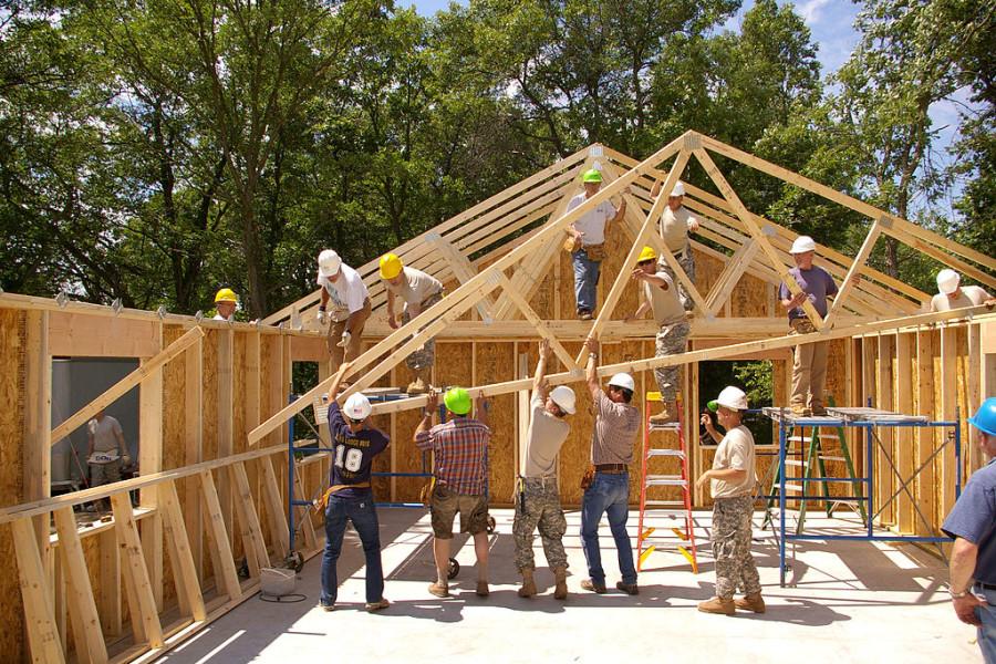  U.S. Army soldiers, along with volunteers from the community, install roof trusses for a Habitat for Humanity home in Brainerd, Minn.
Photo by:  Sgt. Nicholas Olson [Public domain], via Wikimedia Commons