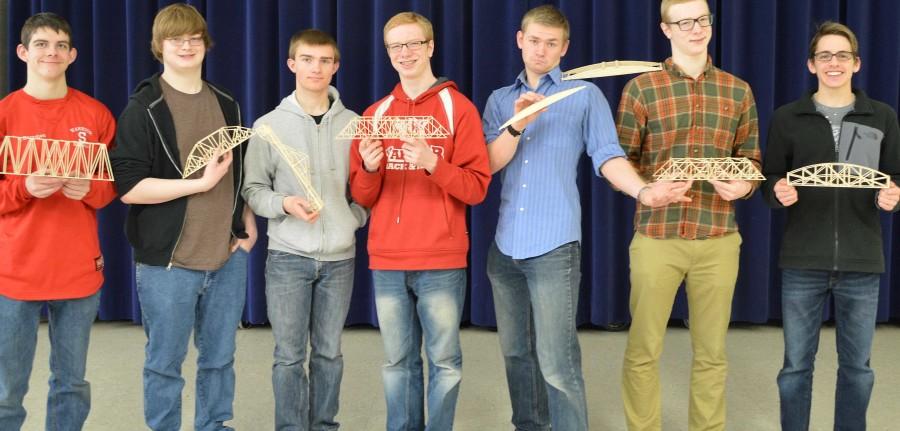 Students in the competition posing with their bridges.