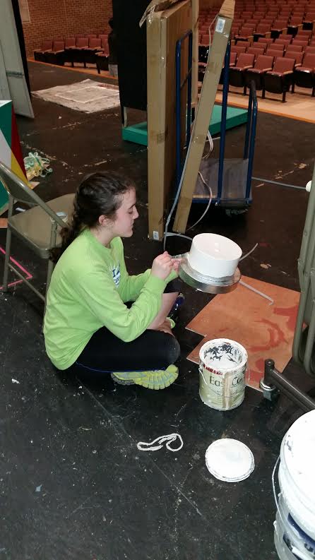 Junior and stage crew member Brigit Duffy works on a piece to be used during the show.  Photo By: Eric Paules