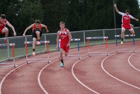 The boys team competes in 300m hurdles. 