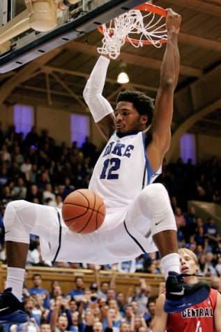 Freshman Justise Winslow dunking in a regular season game. Photo by Getty Images.