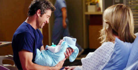 Derek looks upon his newborn son Bailey in season 10. Courtesy of hyable.com. 