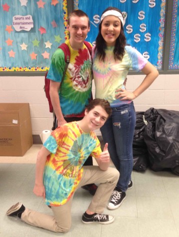 Freshman Michael Torbert is joined with junior Matthew Barnhart and senior Kayla Pringle to celebrate '60s day. Photo by Abigail Bentz.