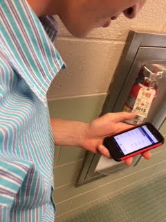 Freshman Jason Delozier uses his phone daily to check grades.