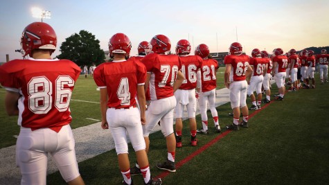 The varsity football team takes the field for another Friday night game. Courtesy of yearbook. 