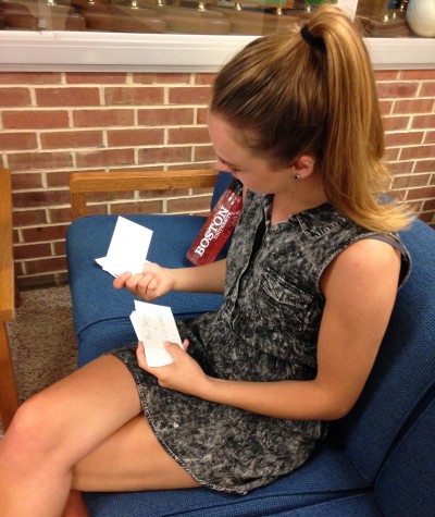 Larum studies flash cards at the NHS tables. Photo By: Grace Burns