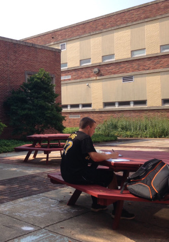 Senior Connor Hood studies at one of the round tables. Photo By: Grace Burns