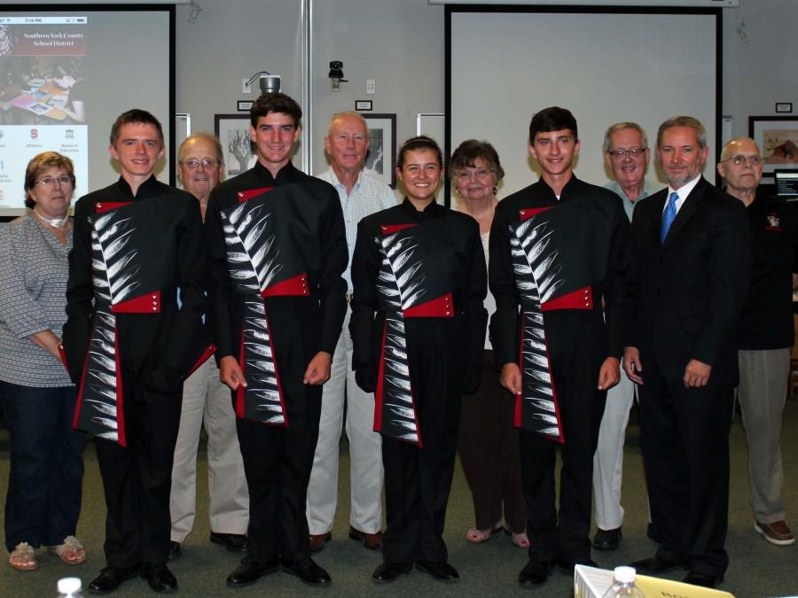 (Featured in the photo are, left to right, back row – C. Dianne Masimore, Allie Wadron, James Holley, Jerri Groncki, Bruce Bauman, and Ron Groncki; front row – Reed McGarvey, Brandon Morris, Taylor Reed, William Strange, and Robert Schefter.)