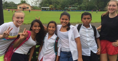 Students pose with children from the local elementary school in La Fortuna, Costa Rica. 