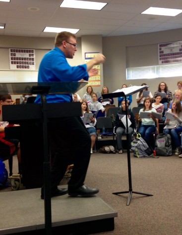 Choir director Jay Althouse conducts the choir during Seussical the Musical