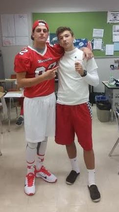 Sophomores Ethan Schammel and Adam Rebich pose in their red and white gear. Photo courtesy of Ethan Schammel. 