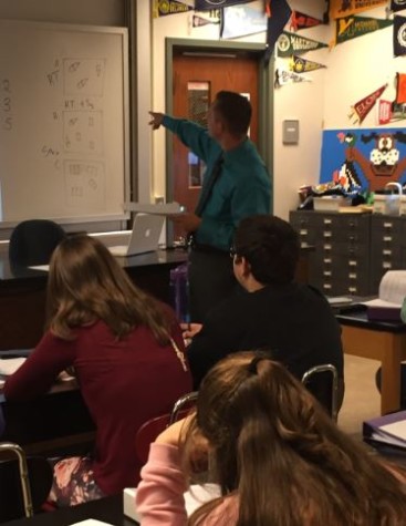 Chemistry teacher Greg Brobst points out important concepts to his students. Photo by Karly Matthews.