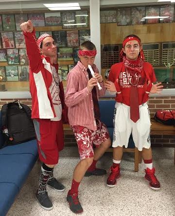 Seniors Daniel Pergrin, Matt Barnhart, and Daniel Stiffler went all out in red and white. Photo by Karly Matthews.