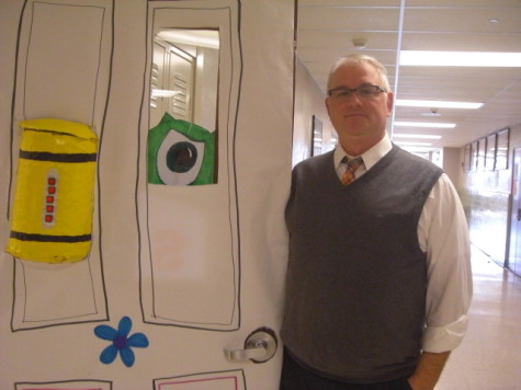 English Teacher Heath Hallman is very proud of the accomplishment his homeroom achieved with the decorating the door. Photo by: Ariel Barbera