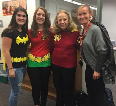 Seniors Megan Longerbeam and Robyn Chandler pose with librarians Sandy May and Kayse Corrieri as Batman and Robin. Photo courtesy of Megan Longerbeam.