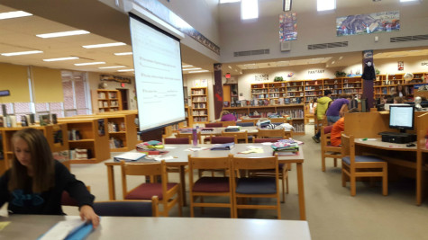 Middle school students and tutors collaborate in the library. Photo By: Francesca Fruti