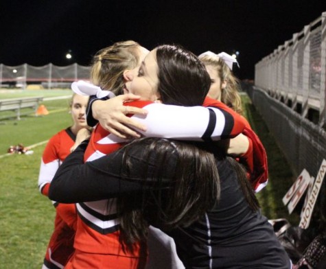 Senior Kayla Bennett hugs Coach Beste after receiving her personalized jersey. Photo by Karly Matthews.