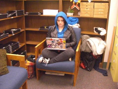 Senior Caitlyn Rassa works hard at the Tech SHED to help students with their Chromebook problems. Photo by: Ariel Barbera