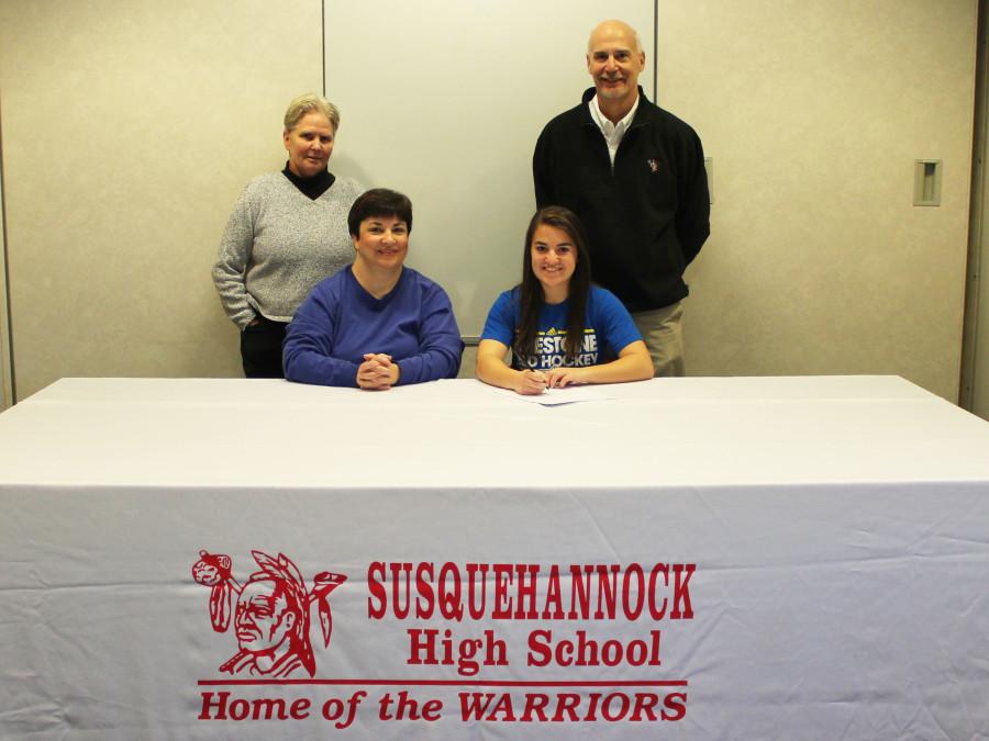 Featured in the photo are Camryn Burk, right, along with her mother, Stephanie Burk, left; in the back row are varsity field hockey coach Sharon McLaughlin, left, and Athletic Director Chuck Abbott, right.