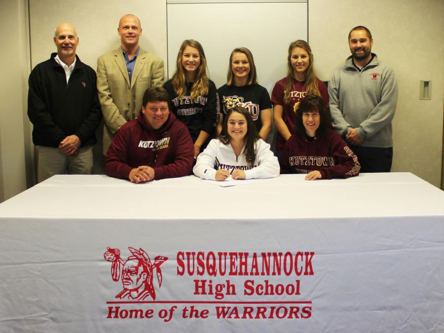 Featured in the photo are Madison Mummert, front row center, along with her parents, Kevin and Allison Mummert; in the back row, left to right, are Athletic Director Chuck Abbott, varsity soccer coach Pat Brubaker, Madison’s sisters, Harley, Cassidy, and Hannah Mummert, and assistant soccer coach Jesse Krotzer.