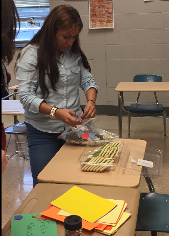 Senior Aleyda Angeles picks out her decorations. Photo by Karly Matthews.