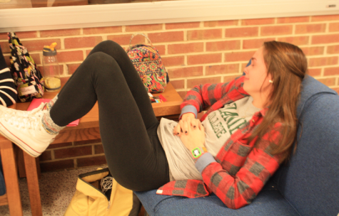 Senior, Emily Houska lounges around in the lobby. Photo By: Mallory Lebo