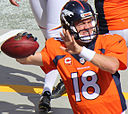 Peyton Manning warming up on the sideline. By Jeffrey Beall (Flickr) [CC BY-SA 2.0 (http://creativecommons.org/licenses/by-sa/2.0)], via Wikimedia Commons