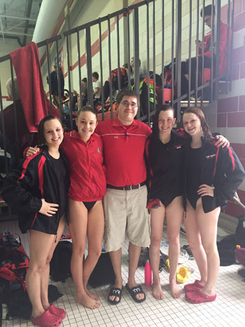 Students pose with their swim coach, WIngert