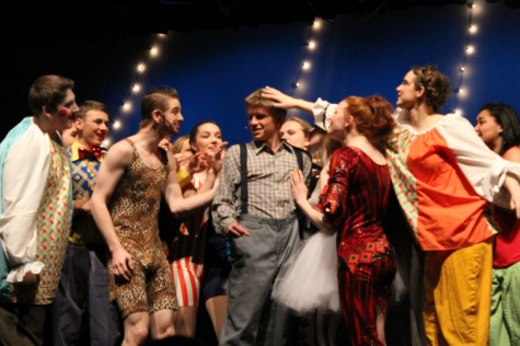 Cast members from the latest musical, "Pippin," gather around Pippin himself (Julian Sherman, center) after he sings his first solo.