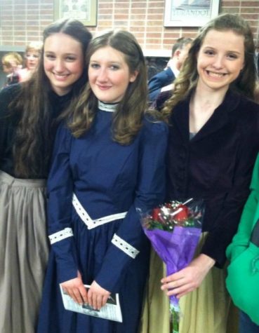 (From left to right) Brooke Weber, Megan Barnish, and Elizabeth Martin, now seniors, pose after a performance of their freshman show, "Phantom of the Opera," the first theater experience for each of them.