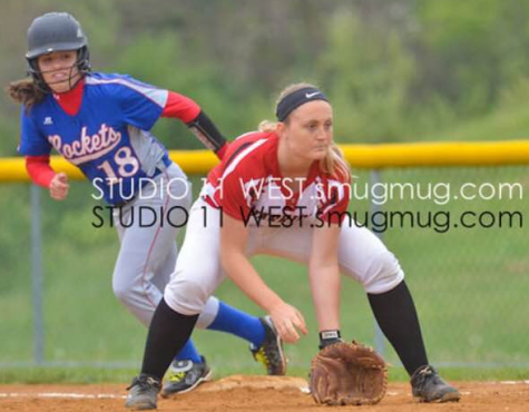 Ally Kerr gets into defensive position at first base. Photo By: Studio West Photography