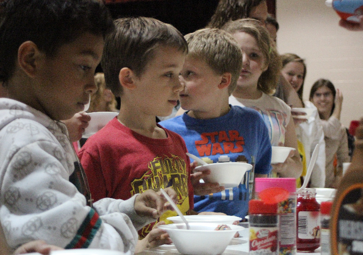 Little buddies line up to get ice cream.  Photo By Grace Burns