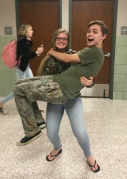 Senior Carsen Bateman and junior Caleb Fair support each other while wearing camo. Bateman thinks that ...camo day is a cool spirit day to have because everyone owns camo, so it is easy to have, said Bateman. Photo by: Katelin Tyler